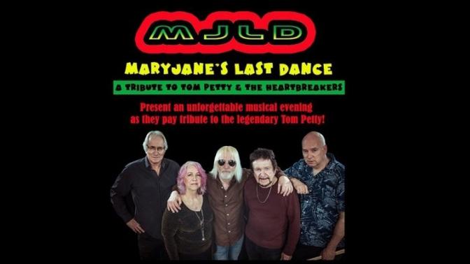 all 5 members of the tom petty tribute band named Mary jane's last dance pose arm in arm