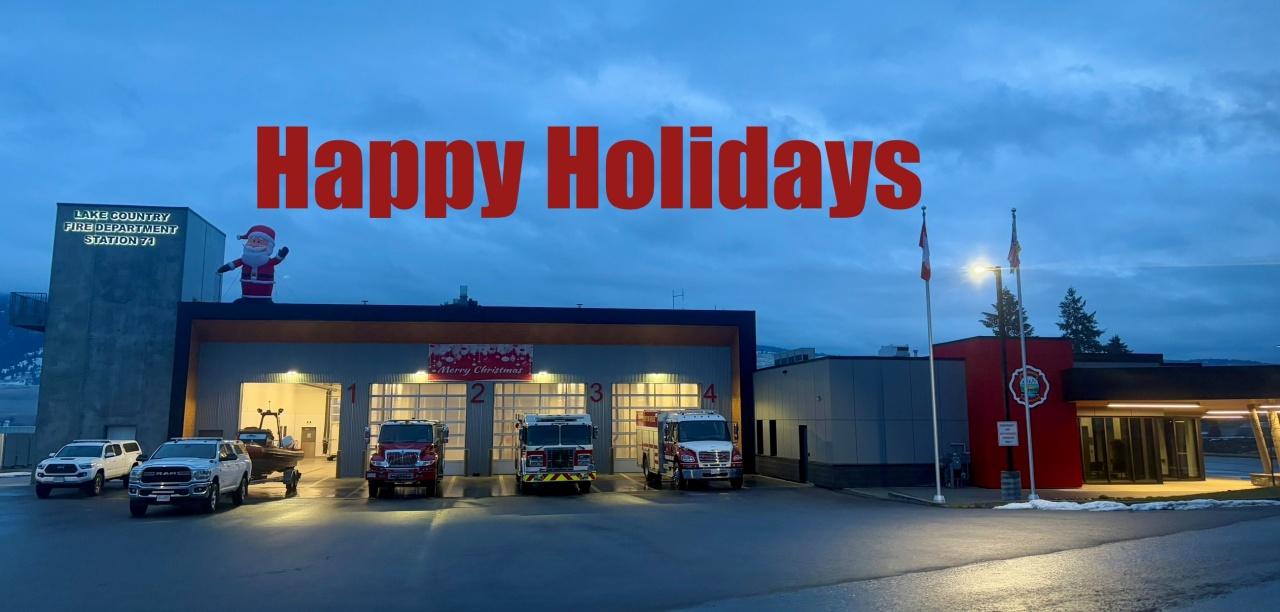 Lake Country Fire Department station 71 with santa on the roof waving happy holidays